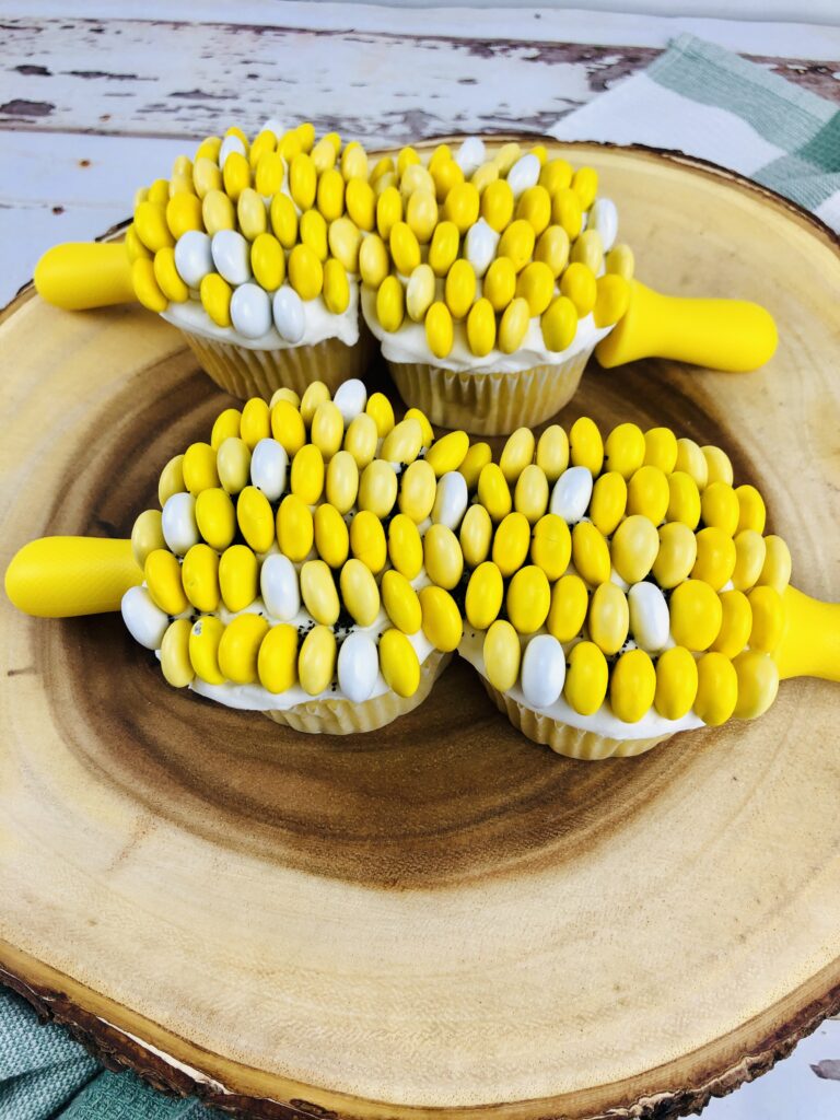 corn on cob cupcakes on a log plate