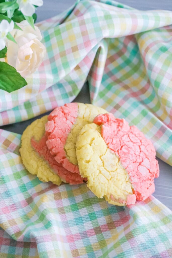 crinkle lemon cookies on a pastel checkered cloth.