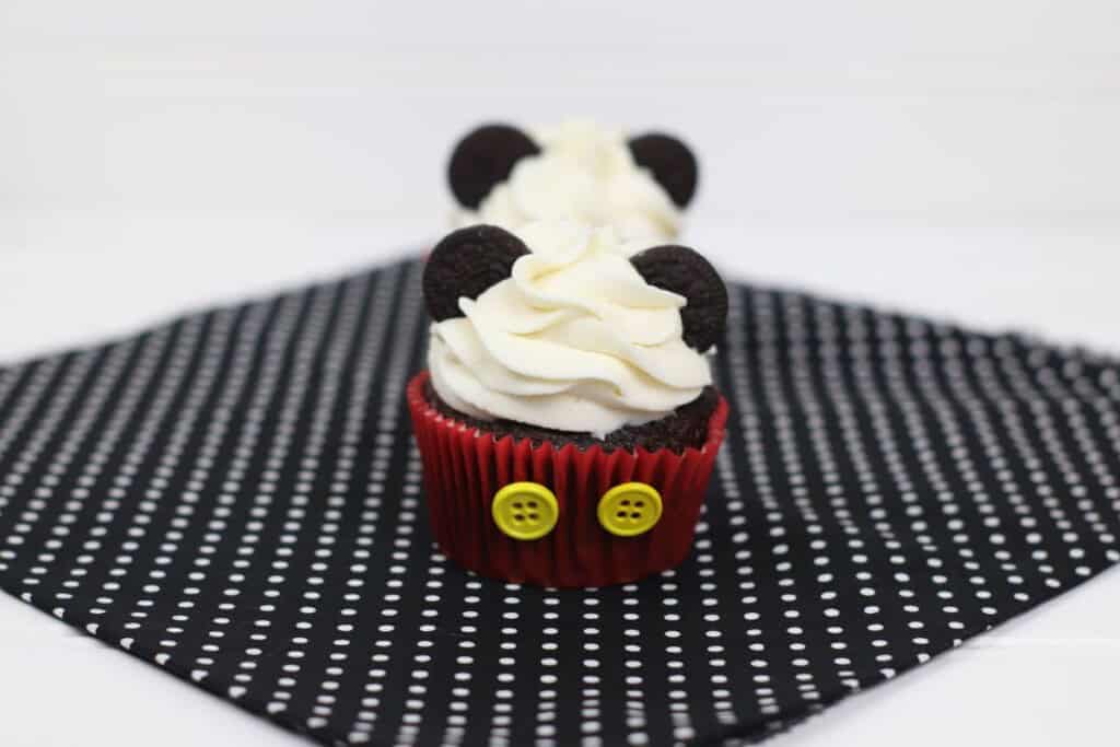 Two adorable mickey mouse cupcakes.