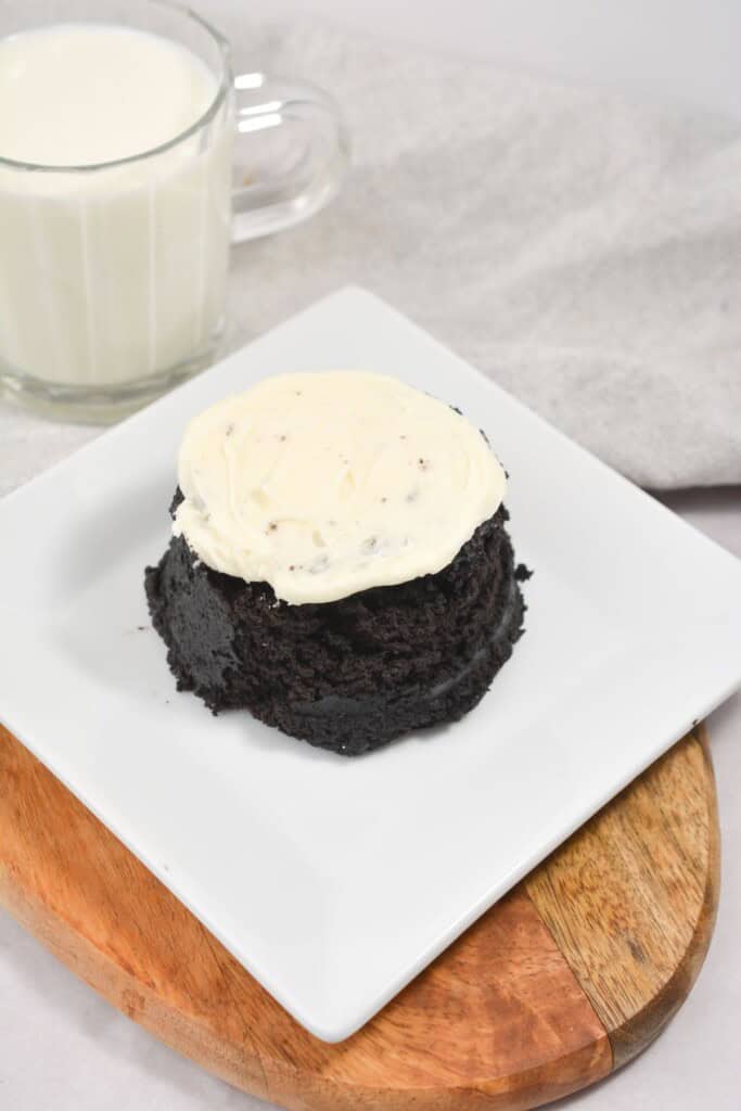 A microwave oreo cake on a white plate.
