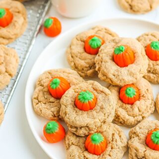 Plate full of spice cake mix cookies with little candy corn pumpkins at their centers