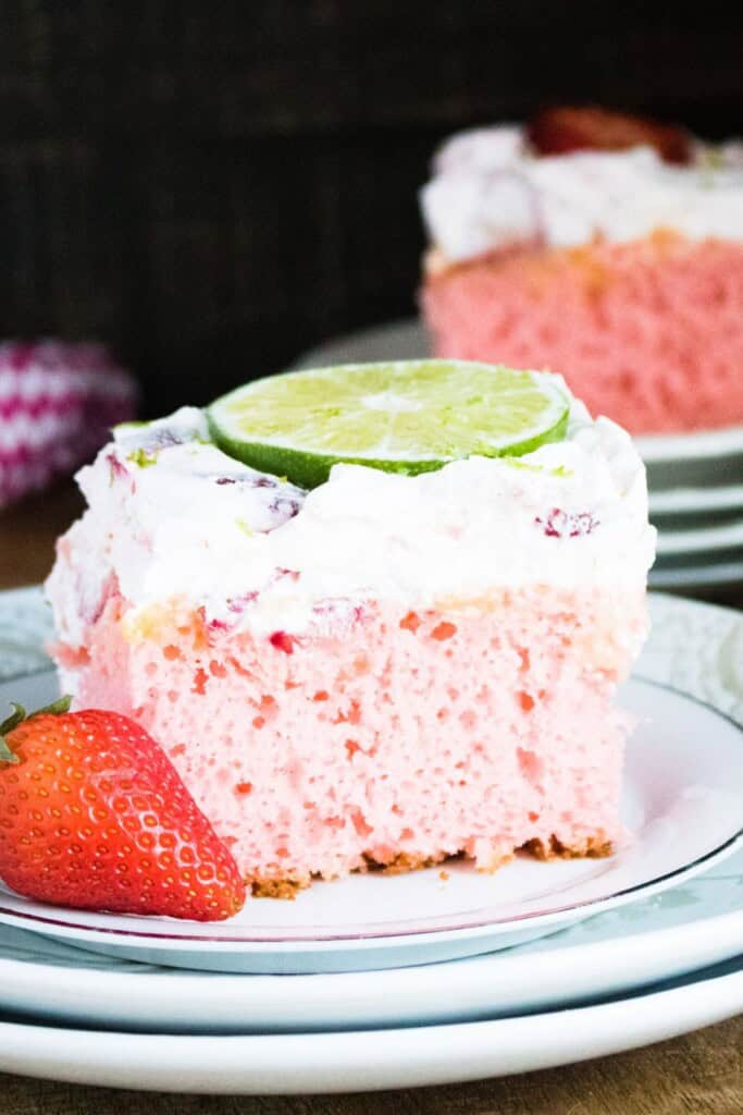 A slice on a white plate with one in the background.