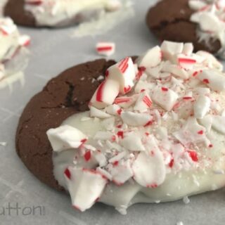 chocolate peppermint cake mix cookie, dipped in vanilla icing and topped with candy cane bits