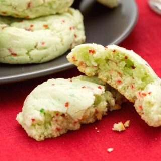 Green Christmas Cake mix cookies with red sprinkles baked in