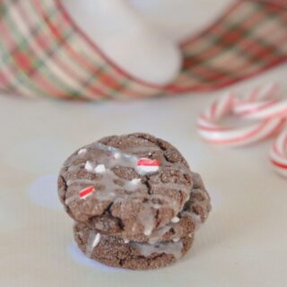 Chocolate Peppermint cake mix cookies with frosting and sprinkles on top