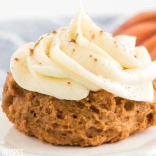 pumpkin cake mix cookie with cream cheese frosting on top