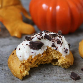 A box mix shortcut keeps these fall flavored cookies quick and easy. Pumpkin Cake Mix Cookies piled high with cream cheese frosting.