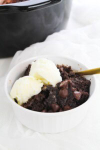 A spoon in the chocolate lava cake.