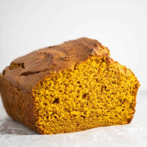 a loaf of golden brown pumpkin bread