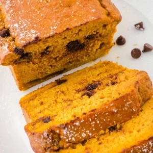 a sliced loaf of pumpkin bread with chocolate chips in it