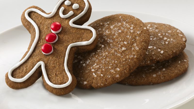 Gingerbread man cookie with icing and red decorations
