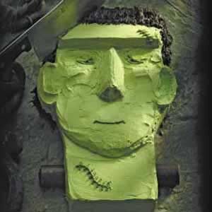 Spooky Frankenstein cake with knife in head