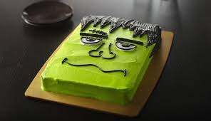 Green Frankenstein monster cake with black icing hair
