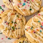 A stack of funfetti cookies on a white tray.