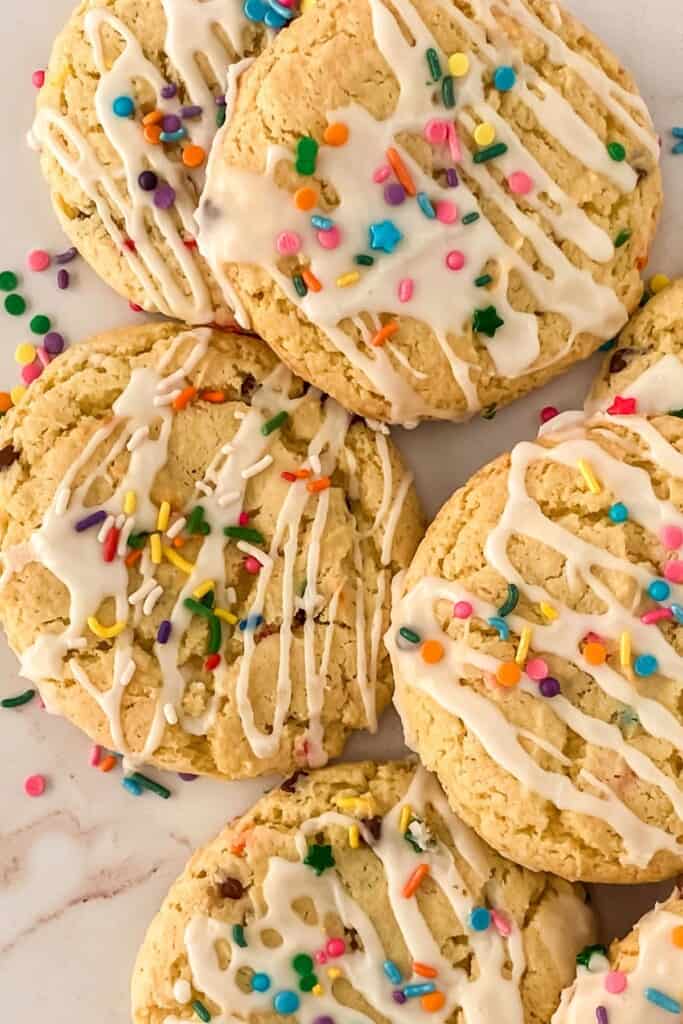 A stack of funfetti cookies on a white tray.