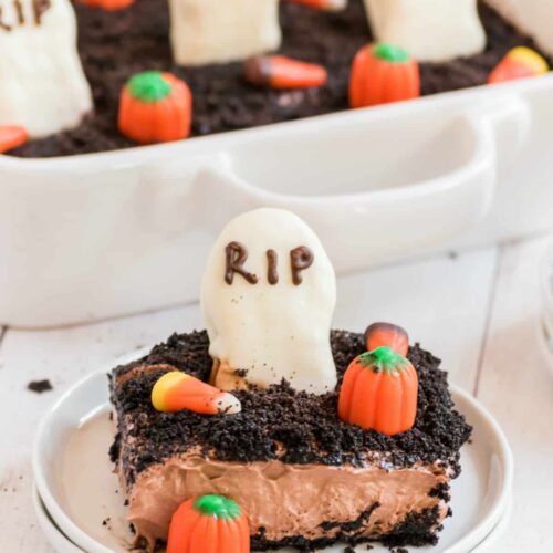 Spooky dirt cake with cookie gravestone and candy