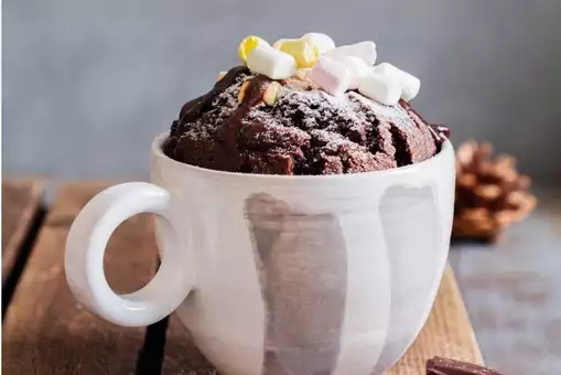 Nutella mug cake with marshmallows and chocolate sauce