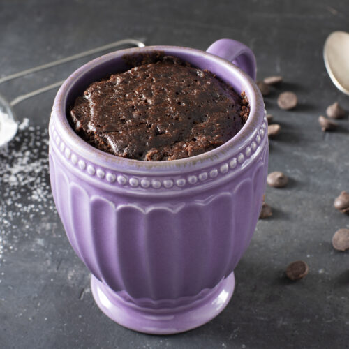 Fudgy brownie in a mug with dark chocolate