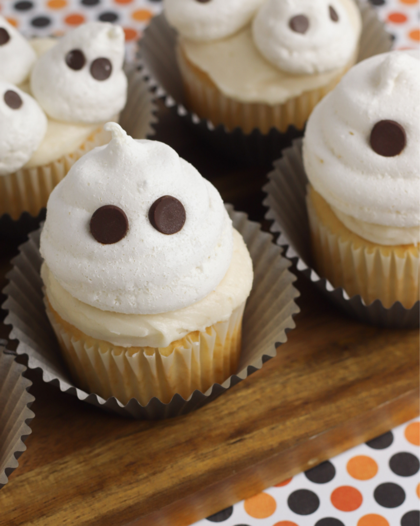 a closeup of ghost halloween cupcakes.