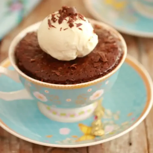 Decadent Nutella brownie in a mug with ice cream