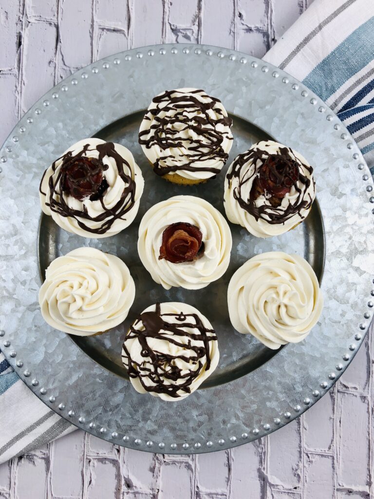 Maple Bacon Cupcakes on a silver platter.