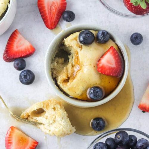 Pancake in a mug with syrup and berries