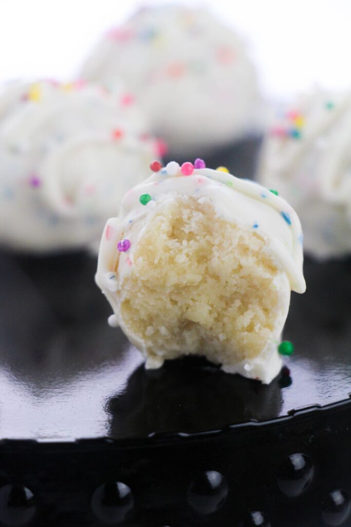 half of a Sugar Cookie Truffle with funfetti sprinkles on top.