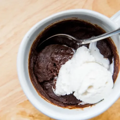 Gluten free brownie in a mug with ice cream