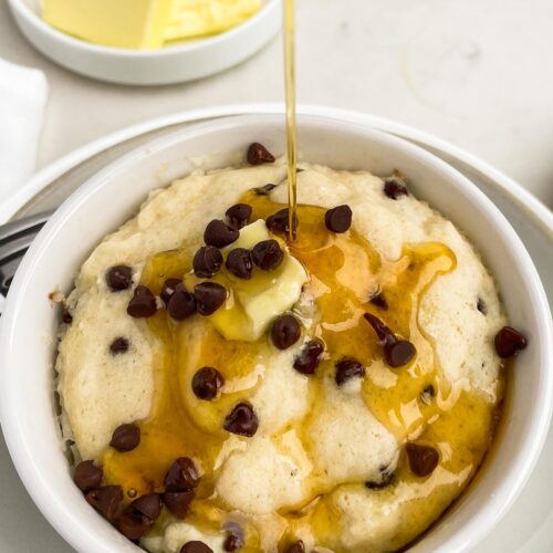Pancake in a mug with chocolate chips, syrup, and butter