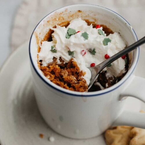 Gingerbread mug cake with red, green and white sprinkles