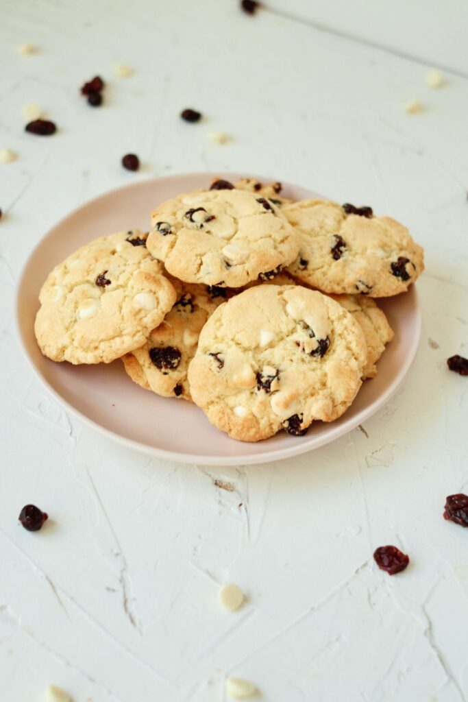 Cranberry White Chocolate Chip Cookies on a plate. 
