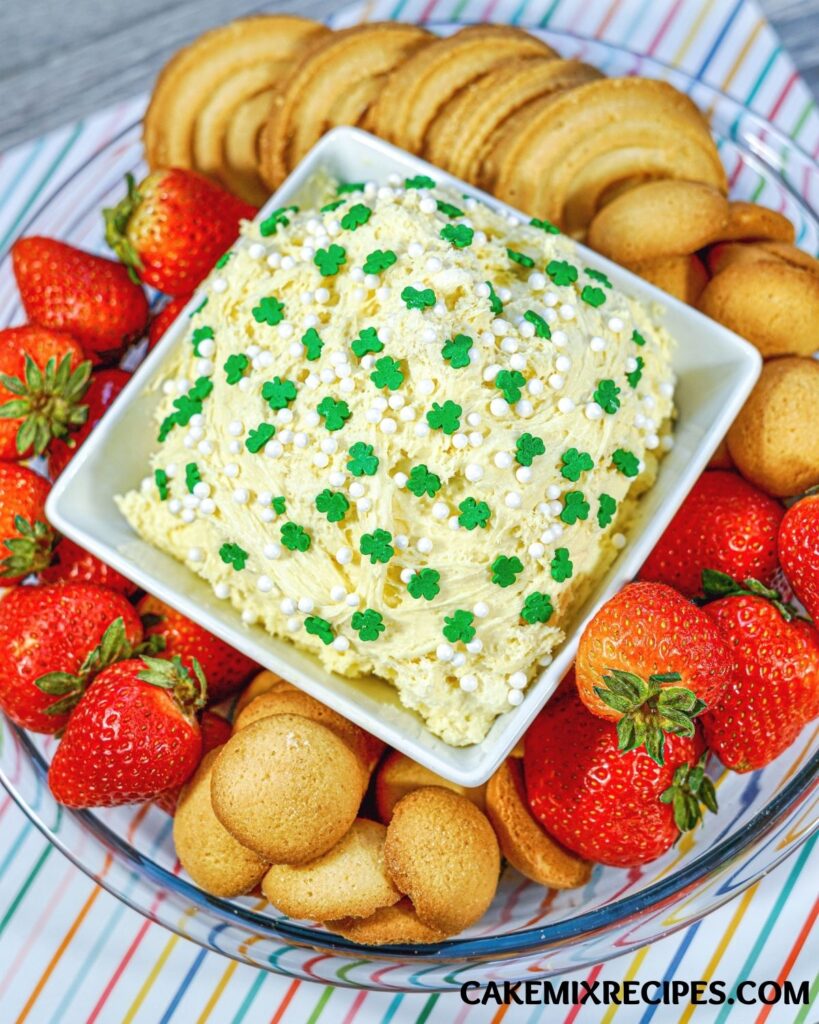 Dunkaroo Dip in a bowl surrounded with strawberries and cookies. 