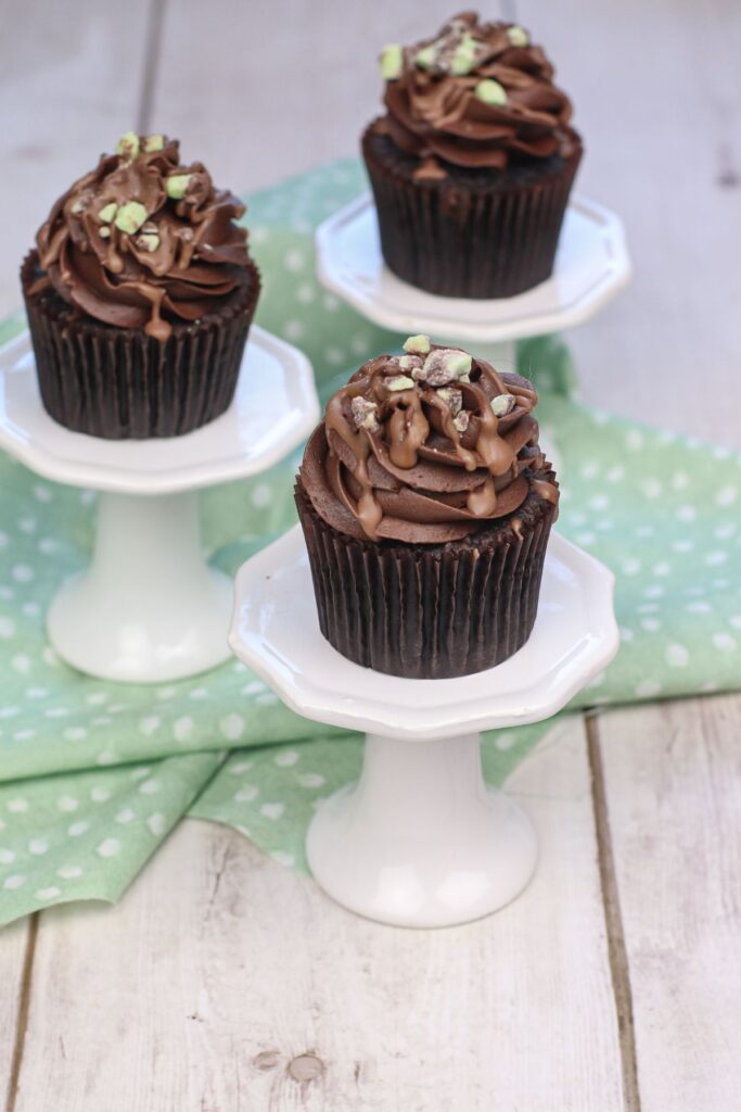 mint chocolate cupcakes on cupcake stands.