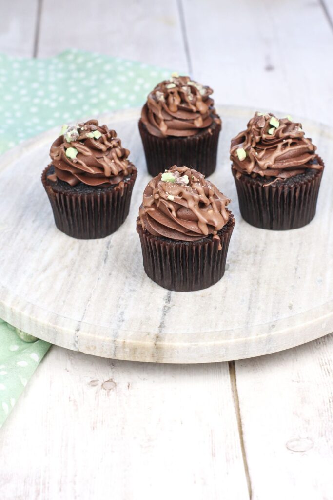 mint chocolate cupcakes on a serving tray.