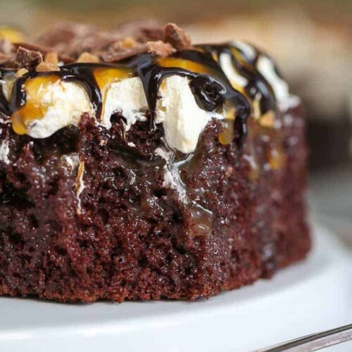 Close-up image of caramel chocolate cake with caramel and chocolate drizzle