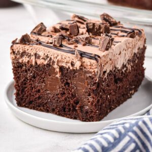 Image of chocolate poke cake topped with chocolate pieces