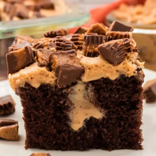 Image of poke cake topped with peanut butter pieces