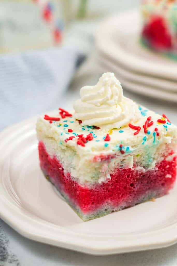 A slice of the finished firecracker cake on a white plate.