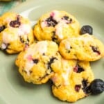 A green plate with lemon blueberry cake mix cookies.