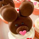 A cute bear cupcake with a pink nose.