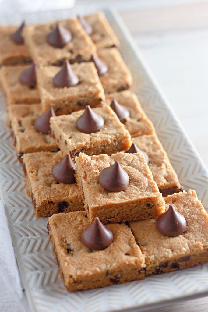 Peanut Butter Cookie Bars on a white serving tray.