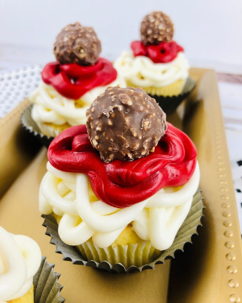 Spaghetti and Meatball Cupcakes on a gold serving tray.