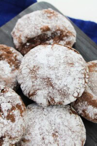 A tray of cookies covered in powdered sugar.