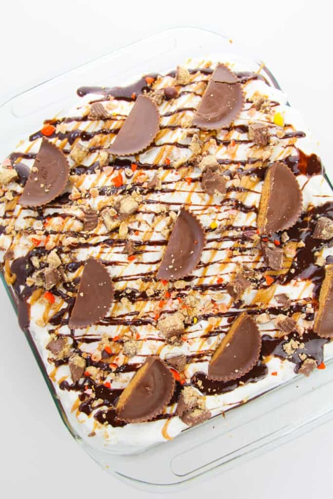 A top shot of the reese peanut butter cup poke cake.