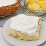 The cake next to some pineapple.