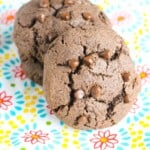 Two chocolate stuffed cookies on a festive plate.