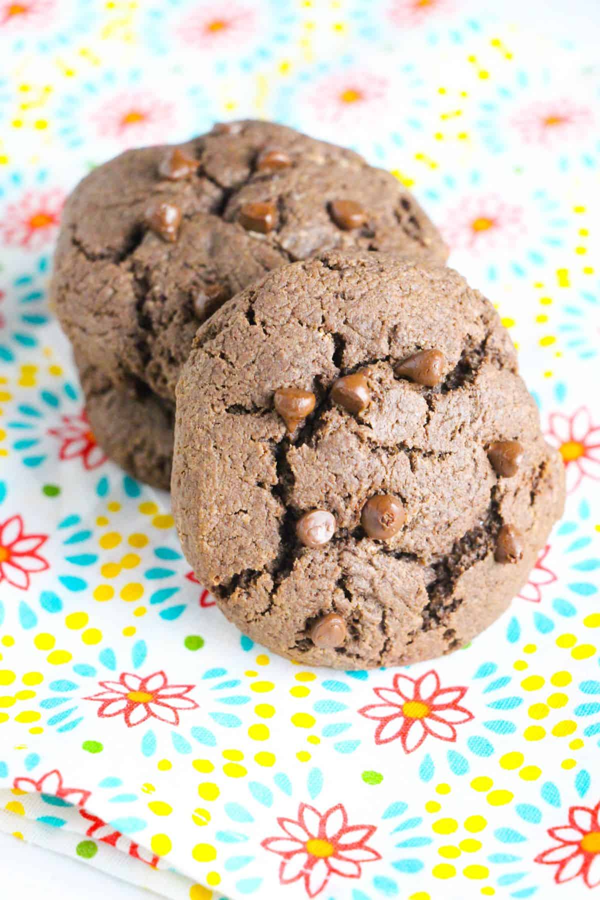 Two chocolate stuffed cookies on a festive plate.