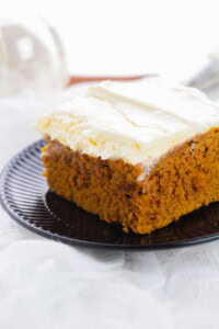 A black plate with the spice cake on top.