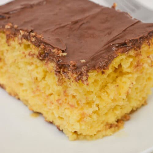 A top shot of the boston cream cake with chocolate chips on the side.