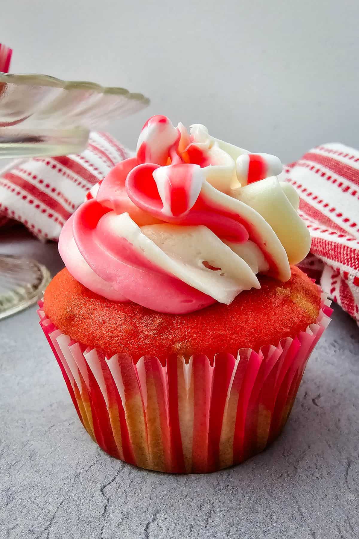 A close look of a candy cane cupcake.